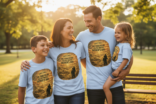 Family in park wearing light blue Coalfields tees