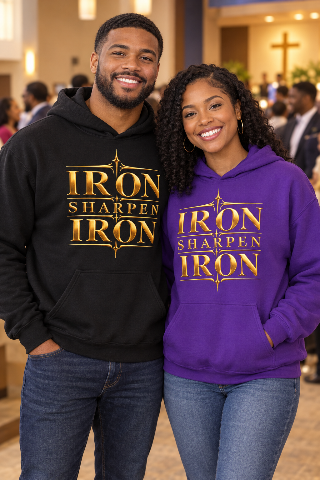Man in black and woman in purple Iron Sharpens Iron hoodies facing forward at church