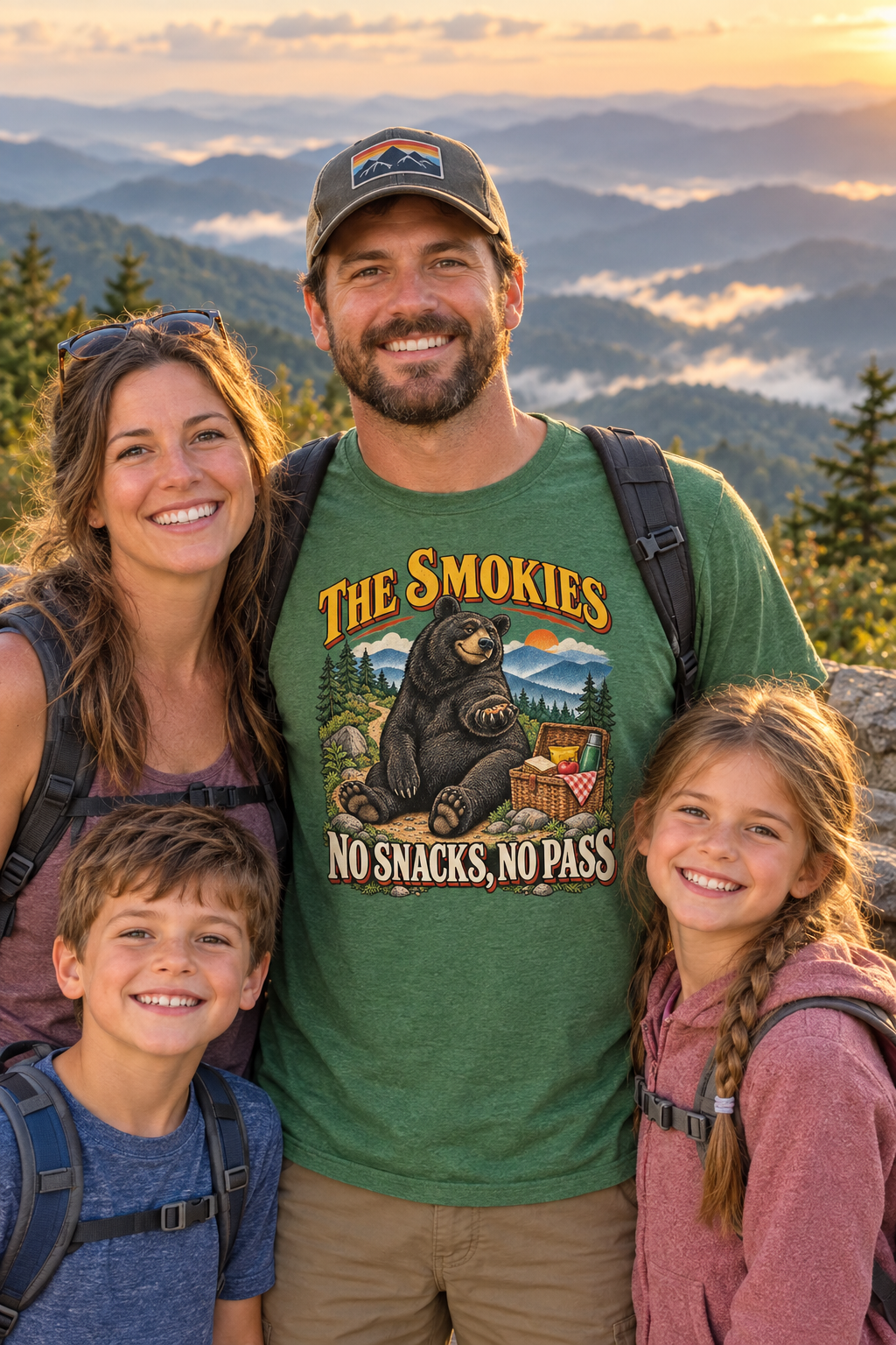 Family wearing heather green Smokies bear t-shirt on a mountain overlook at sunset