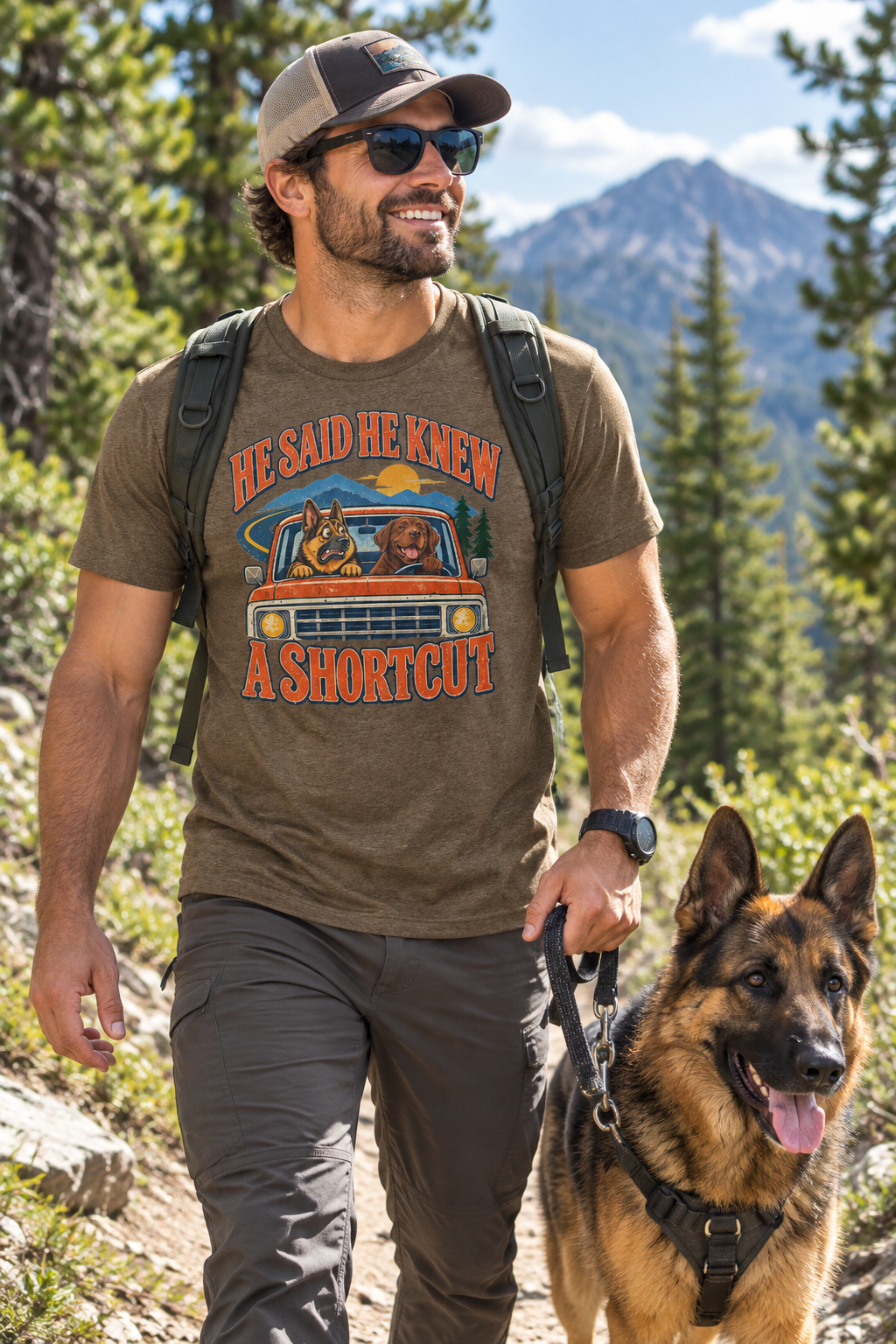 Dad hiking a mountain trail with his German Shepherd wearing the He Said He Knew A Shortcut tee