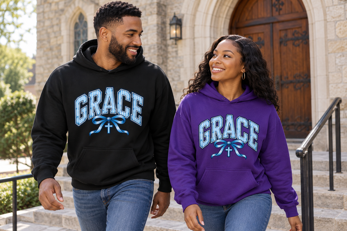 Husband in black and wife in purple GRACE hoodies walking together on church steps, blue chest artwork visible